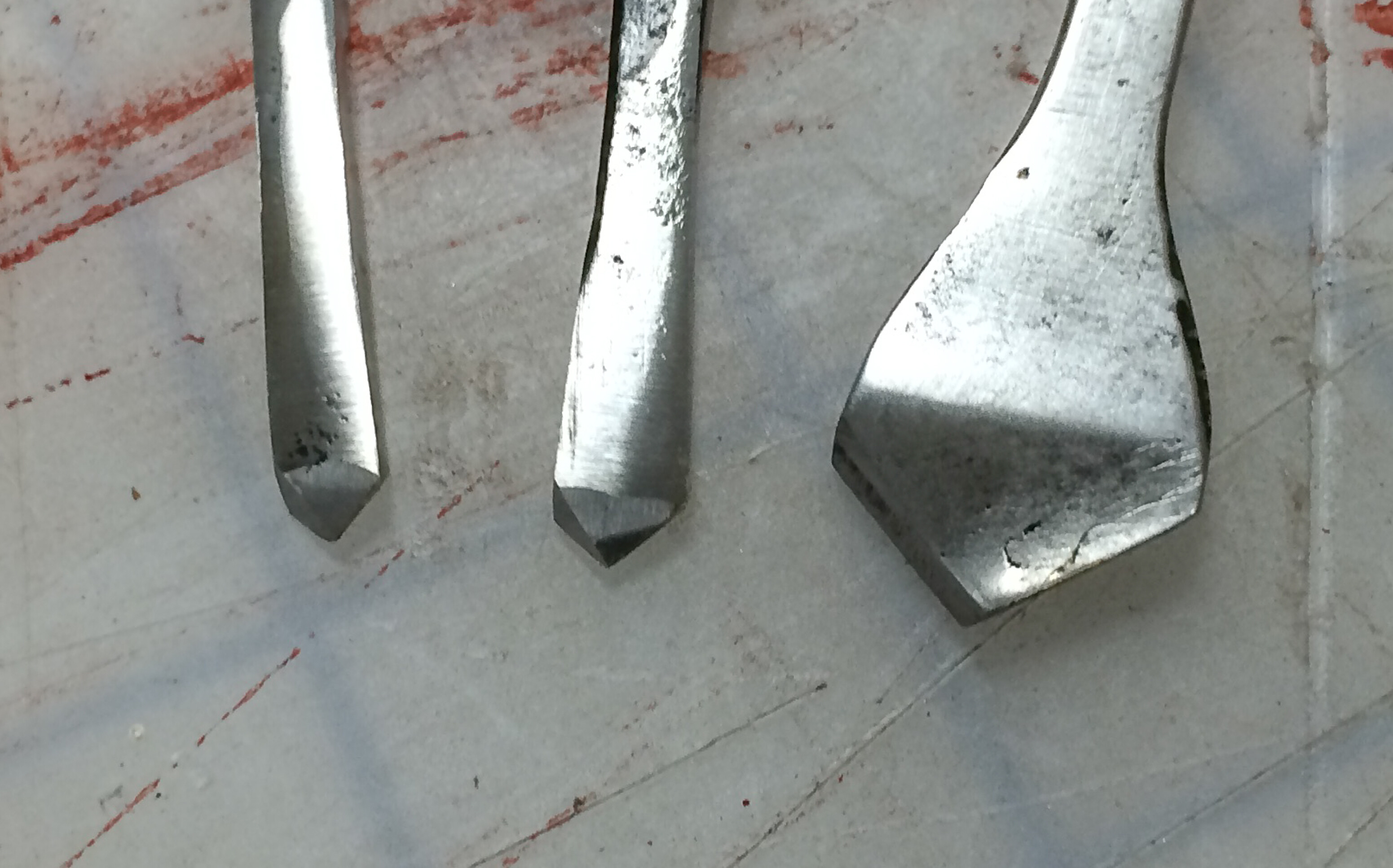 Close-up of 18th century metal cutting drill bits and a countersink for a brace.